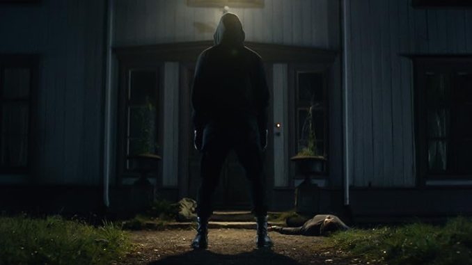 A masked killer terrorizes a group of teenagers in "Dark Windows"